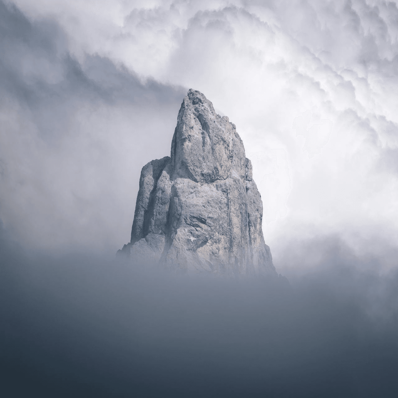 A mountain surrounded by clouds